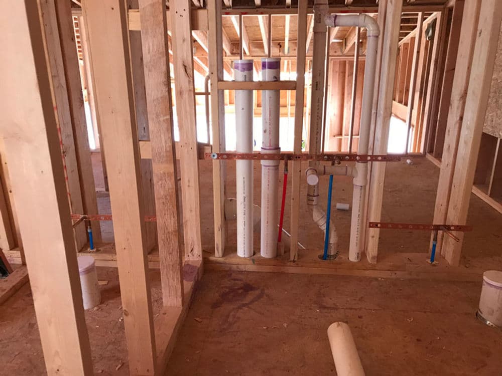 Experienced plumber fixing a leak